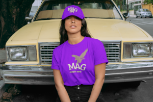 crewneck-t-shirt-mockup-of-a-woman-with-a-dad-hat-posing-in-front-of-an-old-car-28605