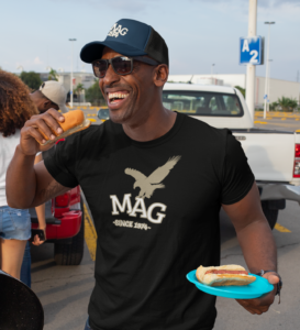 t-shirt-mockup-of-a-man-with-a-trucker-hat-eating-at-a-tailgate-party-29893