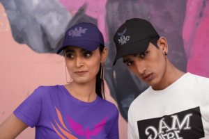 gildan-t-shirt-and-dad-hat-mockup-featuring-a-man-and-woman-posing-against-a-painted-wall-m31901